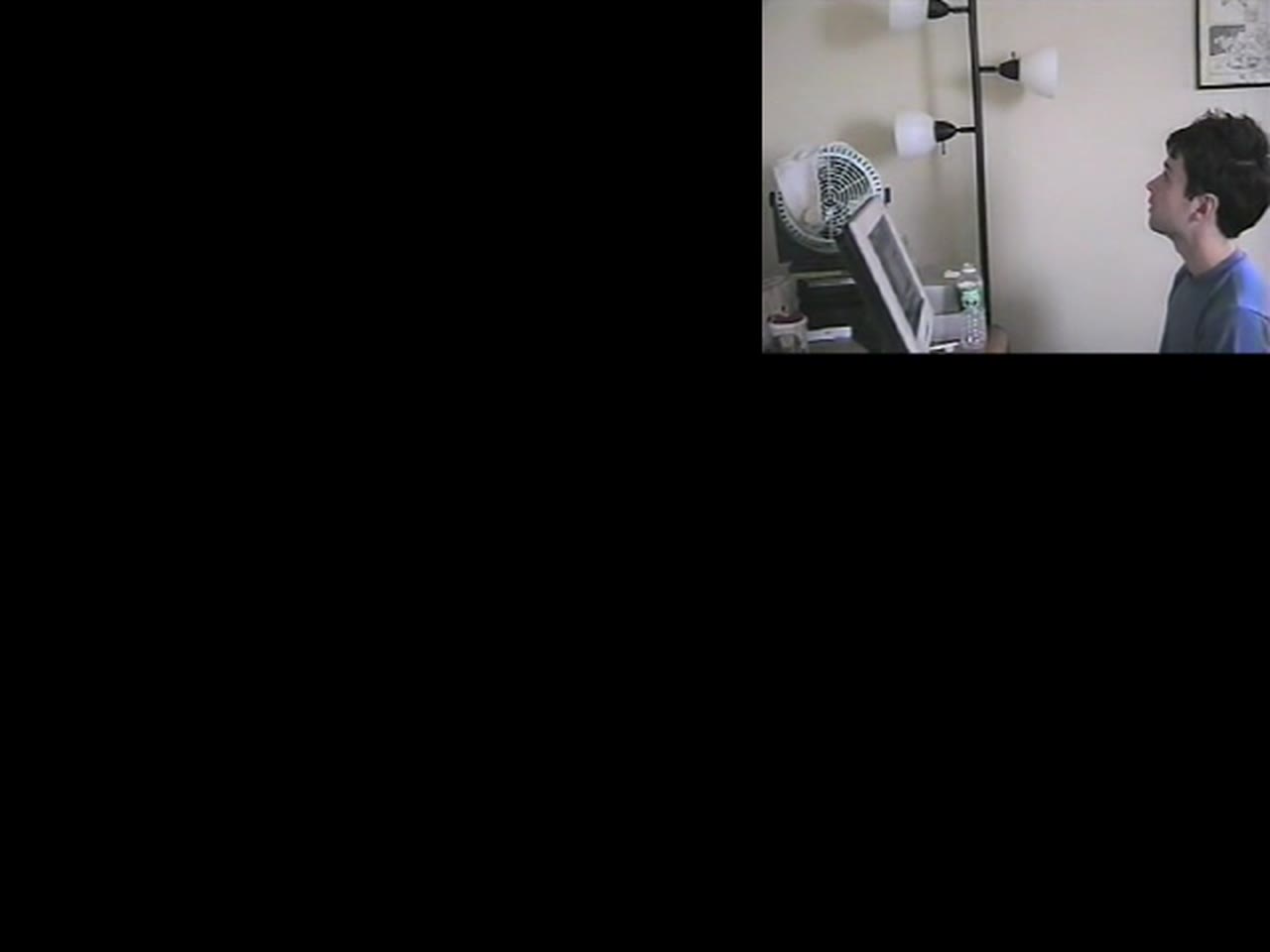 Episode 14 — the desktop gone black, only the webcam left: pyr0 looking up at the dead screen